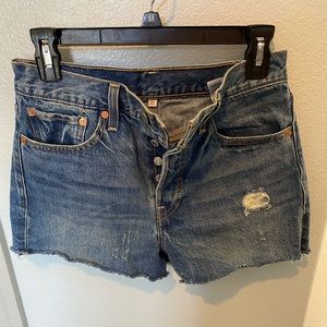 Distressed cut off jeans